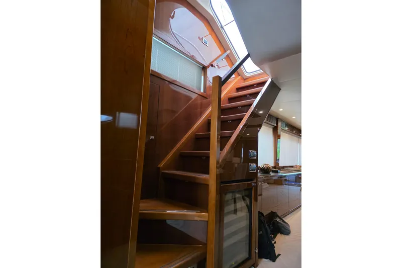 Oasis Yacht Photos Pics Interior staircase of 2010 Princess 95 Motor Yacht with wooden finish and modern design.