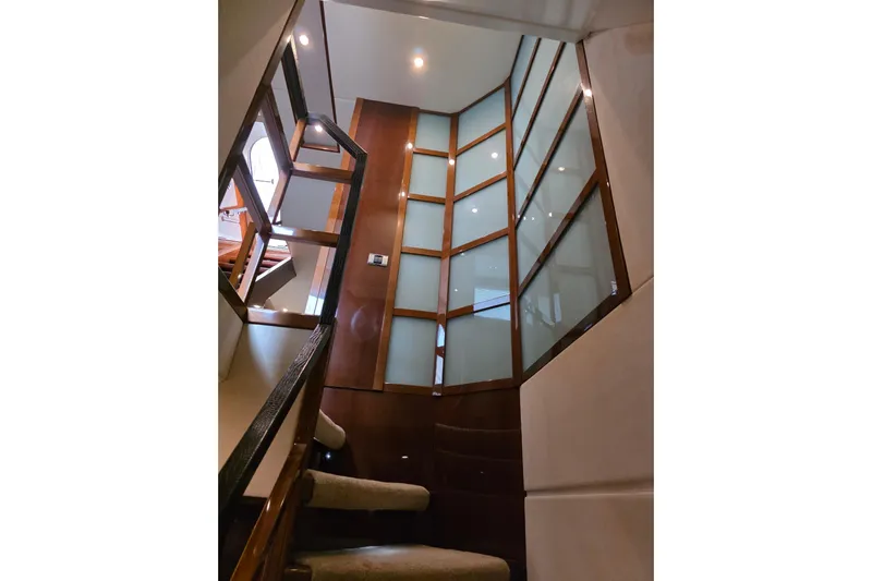 Oasis Yacht Photos Pics Interior staircase of 2010 Princess 95 Motor Yacht with modern design and wood accents.