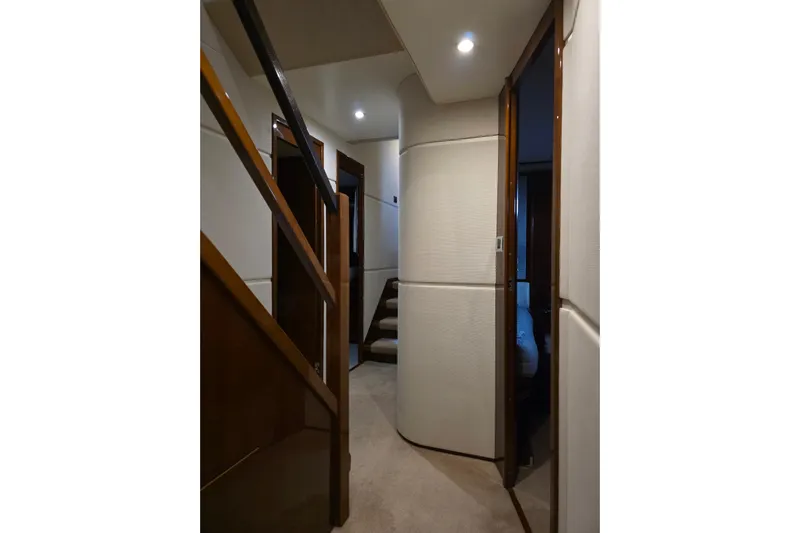 Oasis Yacht Photos Pics Interior hallway of 2010 Princess 95 Motor Yacht with modern design and soft lighting.