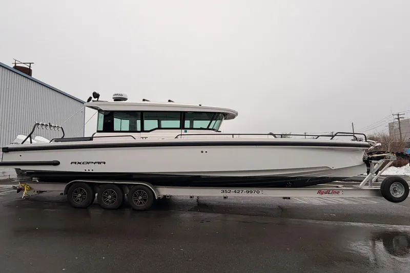  Yacht Photos Pics 2021 Axopar 37 XC Cross Cabin boat on trailer, side view.