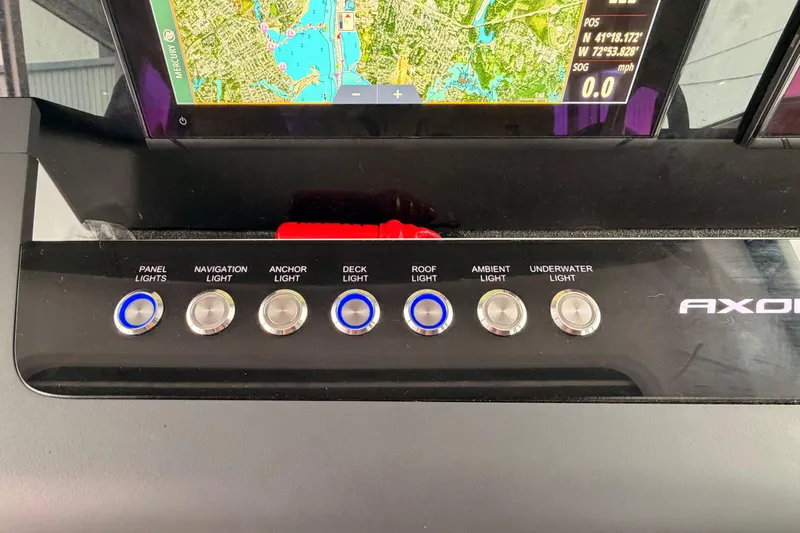  Yacht Photos Pics Control panel of 2021 Axopar 37 XC Cross Cabin with navigation map display.