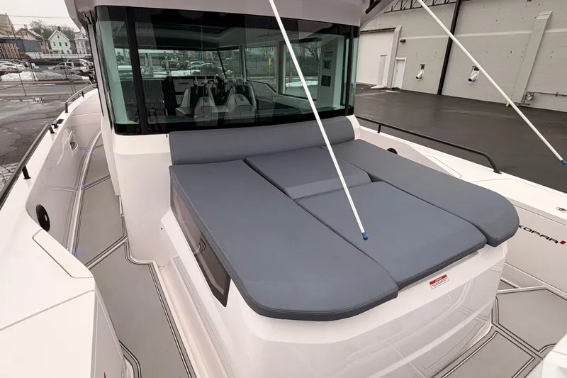  Yacht Photos Pics 2021 Axopar 37 XC Cross Cabin with spacious deck and cushioned seating area.