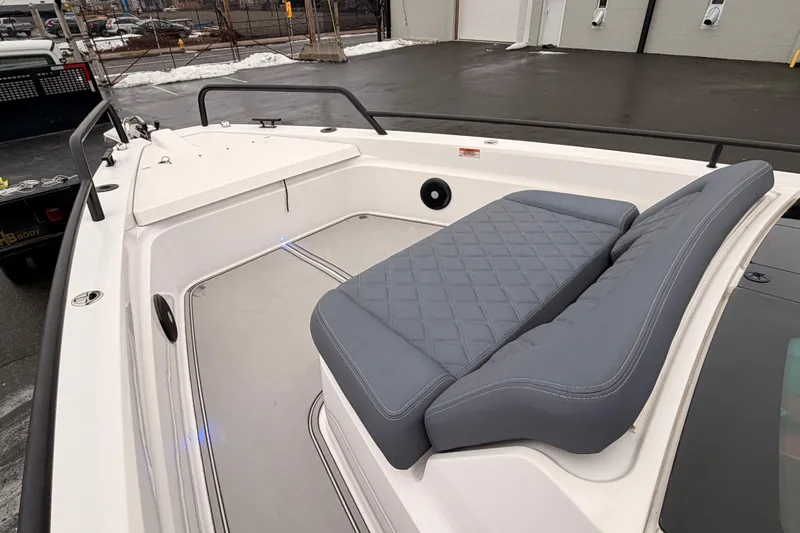  Yacht Photos Pics 2021 Axopar 37 XC Cross Cabin boat with gray cushioned seating on deck.