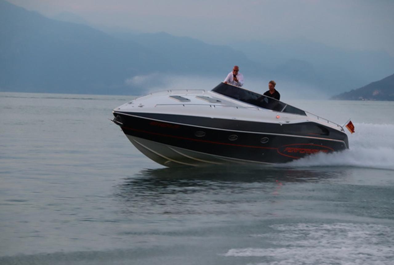 High-speed Performance 1201 boat cruising on a calm lake, 2022 model.