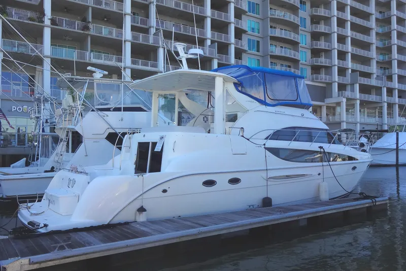 Lit Up Yacht Photos Pics 2007 Meridian 459 yacht docked at marina with Robbins Flynn's Office as a backdrop.