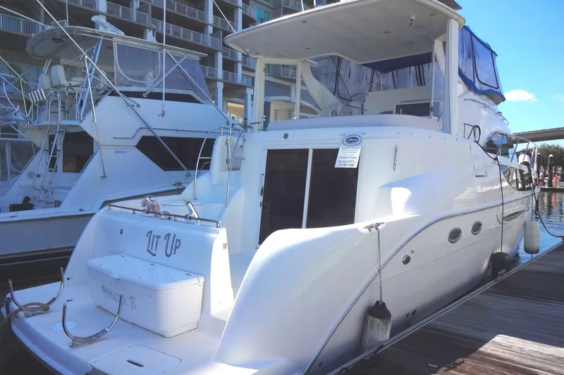 Lit Up Yacht Photos Pics 2007 Meridian 459 yacht docked at marina, featuring sleek white design and spacious deck.