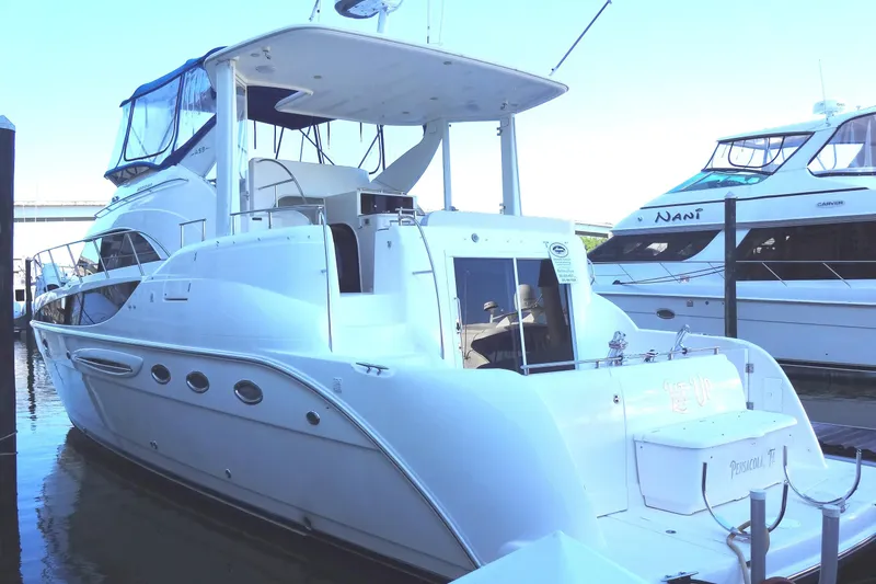 Lit Up Yacht Photos Pics 2007 Meridian 459 yacht docked at marina, featuring sleek white design and spacious deck.