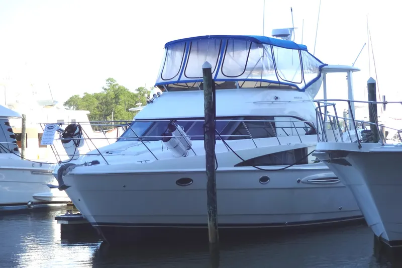 Lit Up Yacht Photos Pics 2007 Meridian 459 yacht docked at marina with blue canopy.