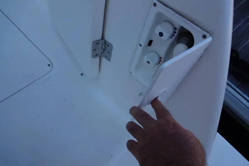 Lit Up Yacht Photos Pics Hand opening control panel on 2007 Meridian 459 yacht deck.