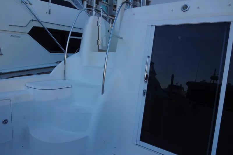 Lit Up Yacht Photos Pics 2007 Meridian 459 yacht with sleek white stairs and glass door.