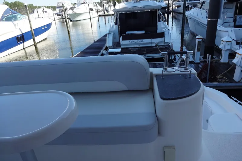 Lit Up Yacht Photos Pics 2007 Meridian 459 yacht interior with seating area at marina dock.