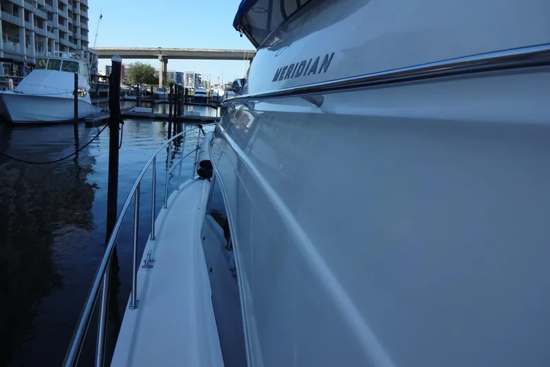 Lit Up Yacht Photos Pics Side view of a 2007 Meridian 459 yacht docked at a marina.