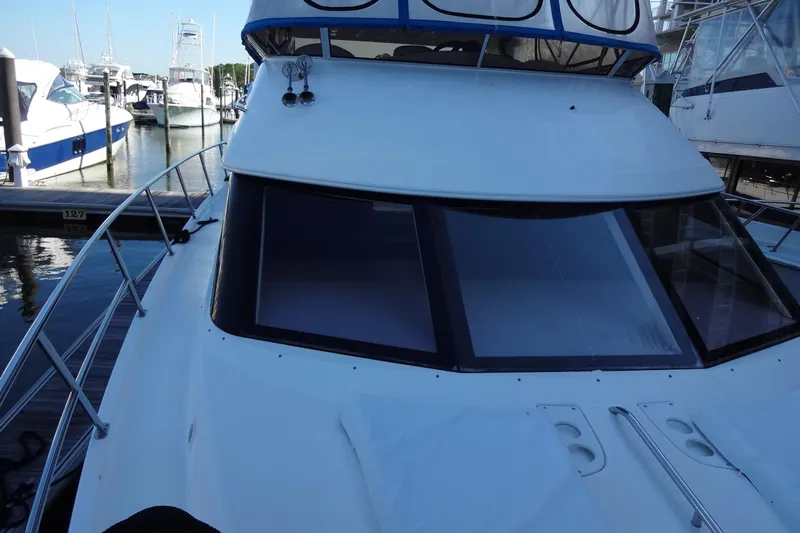 Lit Up Yacht Photos Pics 2007 Meridian 459 yacht docked at marina, showcasing sleek design and spacious deck.