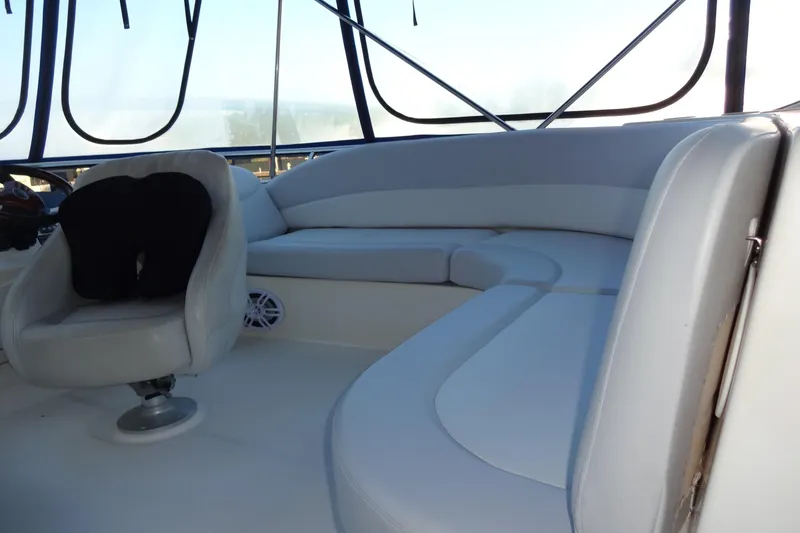 Lit Up Yacht Photos Pics 2007 Meridian 459 yacht interior with white seating and helm chair.