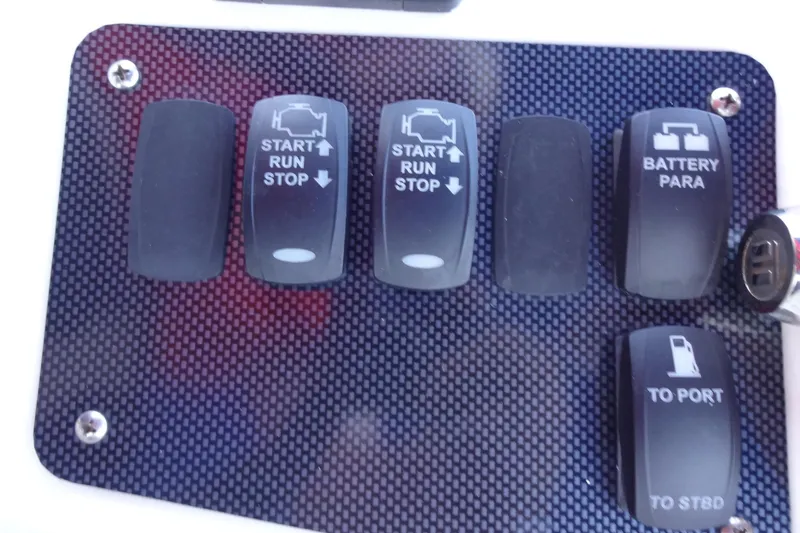 Lit Up Yacht Photos Pics Control panel of a 2007 Meridian 459 yacht with labeled switches.