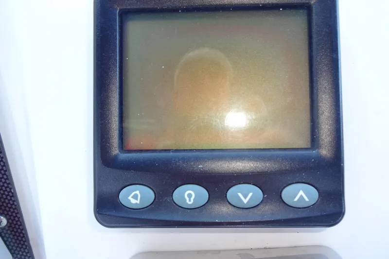 Lit Up Yacht Photos Pics Control panel of a 2007 Meridian 459 boat with navigation buttons.