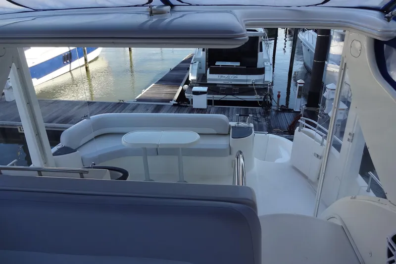 Lit Up Yacht Photos Pics 2007 Meridian 459 yacht interior with seating area and dock view.