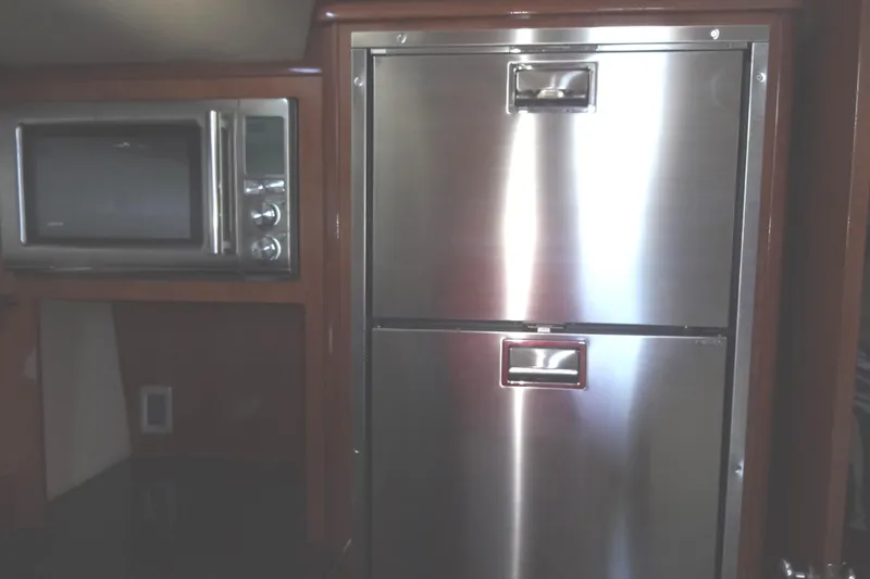 Lit Up Yacht Photos Pics Stainless steel kitchen appliances in a 2007 Meridian 459 yacht interior.
