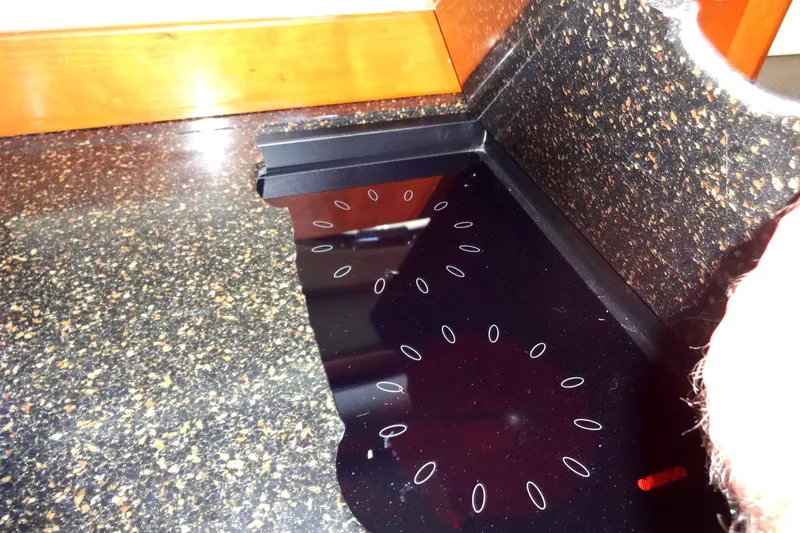 Lit Up Yacht Photos Pics Corian countertop with integrated black cooktop on a 2007 Meridian 459.