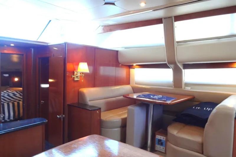 Lit Up Yacht Photos Pics Luxurious interior of a 2007 Meridian 459 yacht with elegant seating and wooden finishes.