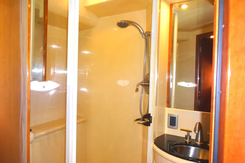 Lit Up Yacht Photos Pics Luxurious bathroom in 2007 Meridian 459 yacht with shower and sink.