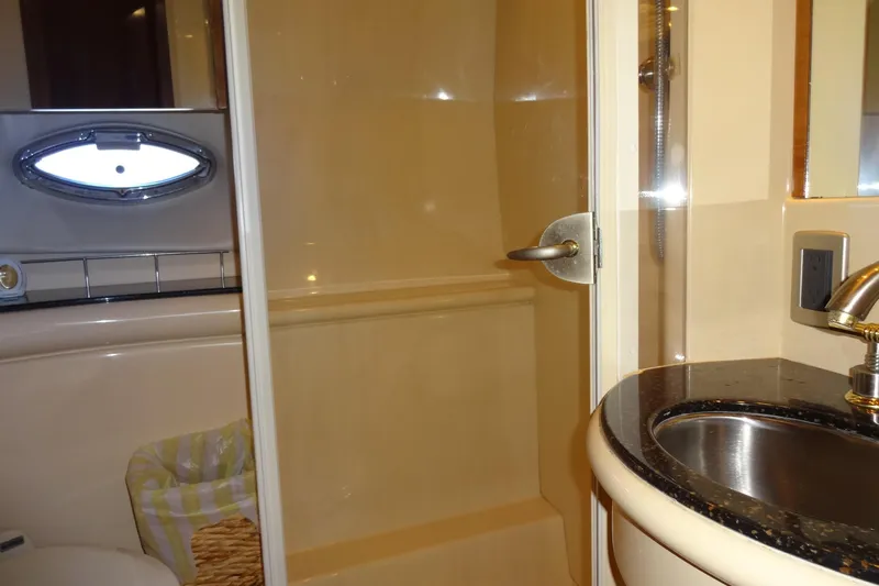 Lit Up Yacht Photos Pics Bathroom interior of 2007 Meridian 459 yacht with shower and sink.