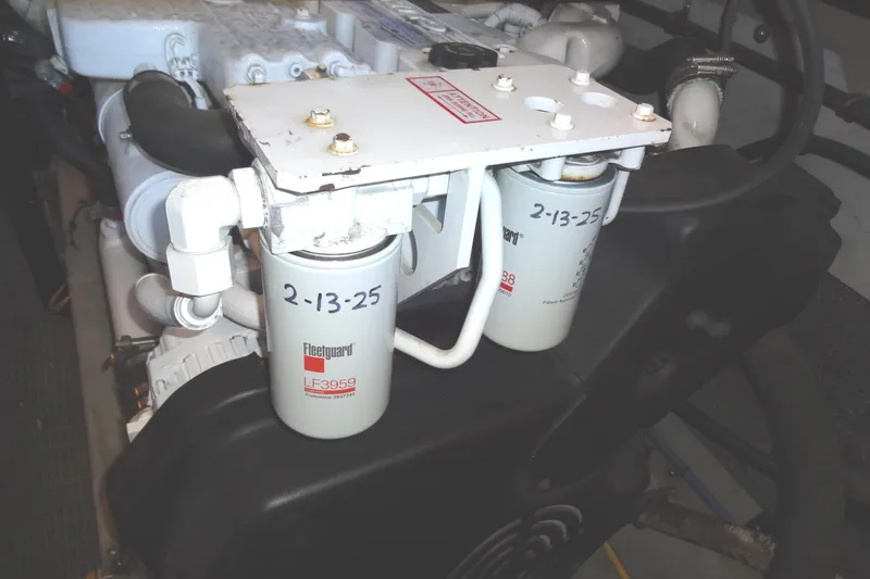 Lit Up Yacht Photos Pics Engine compartment of 2007 Meridian 459 with Fleetguard LF3959 oil filters.