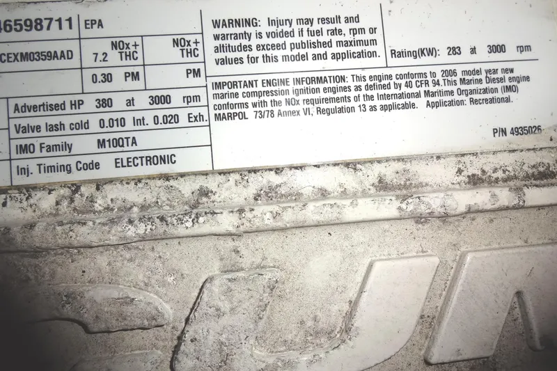 Lit Up Yacht Photos Pics ```json { "alt_text": "Meridian 459 engine specifications label, 2007 model, showing technical details and warnings." } ```