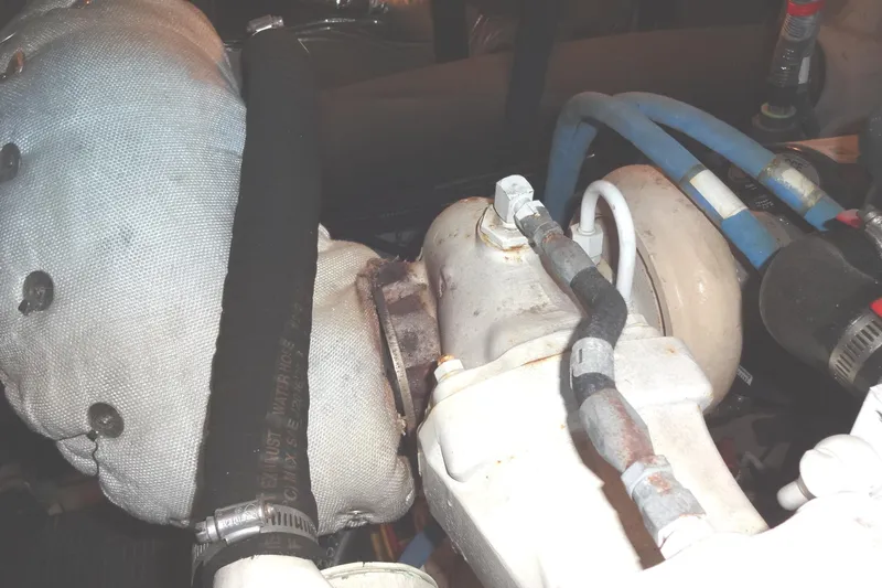 Lit Up Yacht Photos Pics Engine components of a 2007 Meridian 459 yacht, featuring hoses and connectors.