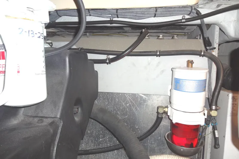 Lit Up Yacht Photos Pics Engine compartment of a 2007 Meridian 459 with visible fuel filter and hoses.
