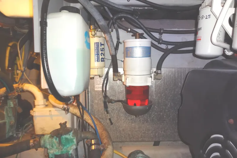 Lit Up Yacht Photos Pics Engine compartment of 2007 Meridian 459 yacht showing fuel filter and hoses.