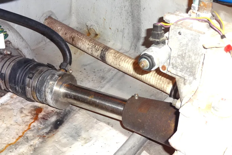 Lit Up Yacht Photos Pics Engine compartment of a 2007 Meridian 459 yacht, showing port shaft mechanical components and hoses.