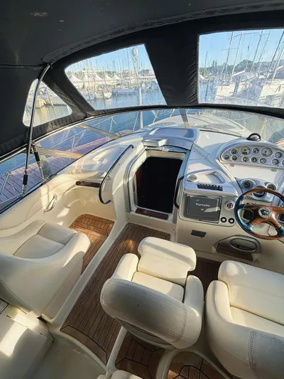  Yacht Photos Pics 2009 Cranchi Endurance 41 yacht interior with helm, seating, and marina view.