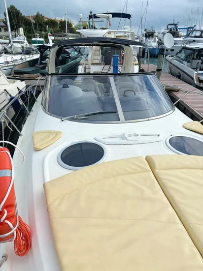  Yacht Photos Pics 2009 Cranchi Endurance 41 yacht docked at marina, featuring sleek design and spacious deck.