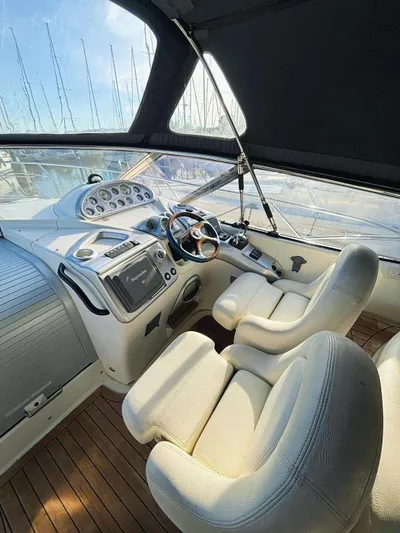  Yacht Photos Pics 2009 Cranchi Endurance 41 cockpit with modern controls and plush seating.