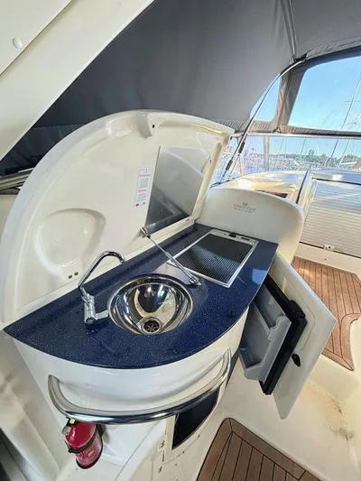  Yacht Photos Pics 2009 Cranchi Endurance 41 yacht kitchenette with sink and stove.