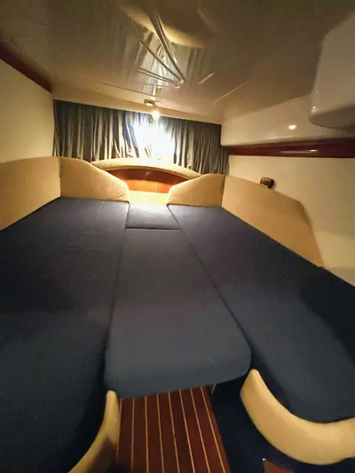  Yacht Photos Pics Interior cabin of 2009 Cranchi Endurance 41 with blue and beige upholstery.