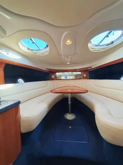  Yacht Photos Pics Interior of 2009 Cranchi Endurance 41 yacht with elegant seating and table.