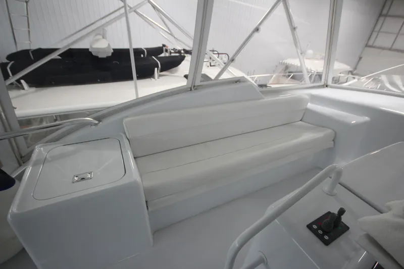 Rollwind Yacht Photos Pics Interior view of 2001 Hatteras 55 Convertible yacht with white seating.