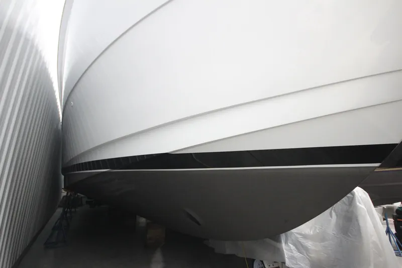 Rollwind Yacht Photos Pics Close-up of 2001 Hatteras 55 Convertible yacht hull in storage.