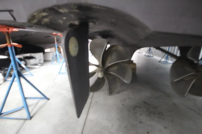 Rollwind Yacht Photos Pics Propeller and rudder of 2001 Hatteras 55 Convertible yacht in dry dock.