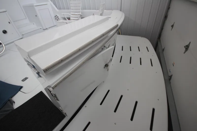 Rollwind Yacht Photos Pics 2001 Hatteras 55 Convertible yacht deck with sleek white finish and stainless steel accents.