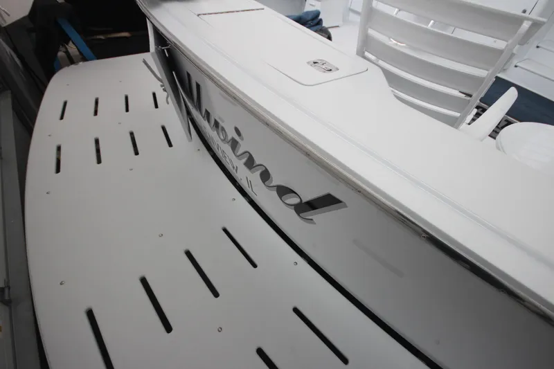 Rollwind Yacht Photos Pics 2001 Hatteras 55 Convertible yacht with sleek white deck and seating.