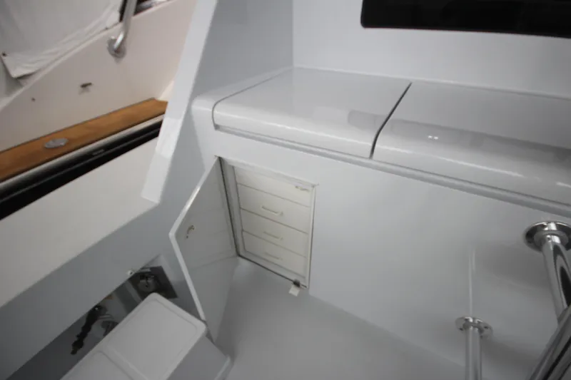 Rollwind Yacht Photos Pics Interior view of 2001 Hatteras 55 Convertible yacht with storage compartments.