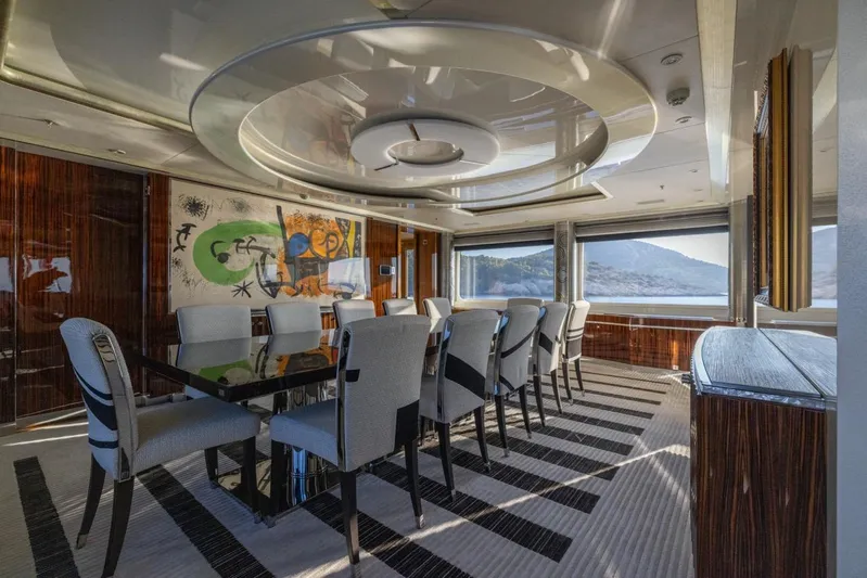 Alfa G Yacht Photos Pics Luxurious dining area on 2004 Oceanco 60 Meters yacht with modern decor and panoramic views.