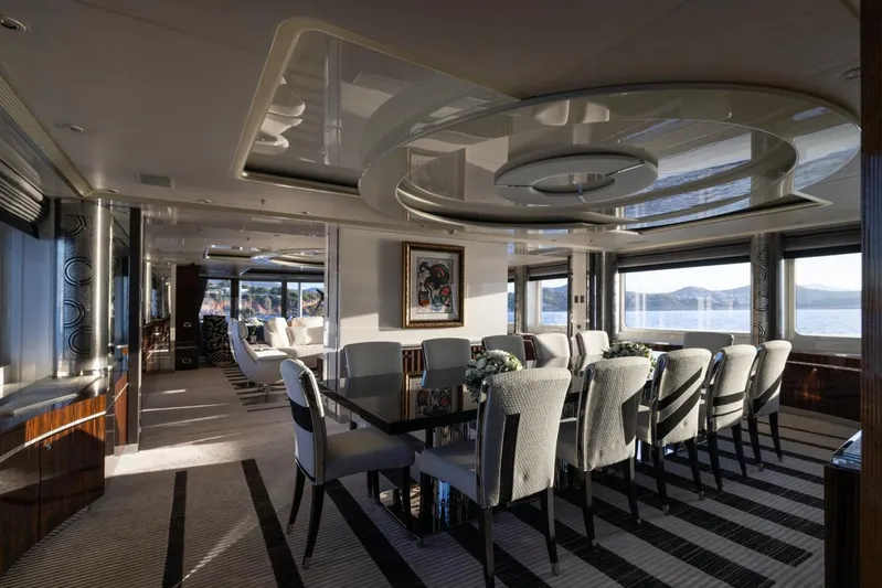 Alfa G Yacht Photos Pics Luxurious dining area on a 2004 Oceanco 60-meter yacht with elegant decor and sea views.