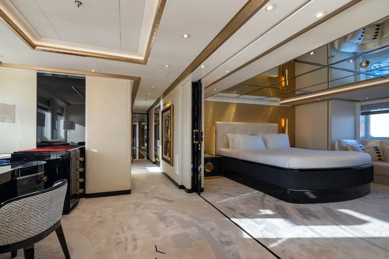 Alfa G Yacht Photos Pics Luxurious bedroom interior on a 2004 Oceanco 60-meter yacht, featuring elegant decor and modern furnishings.