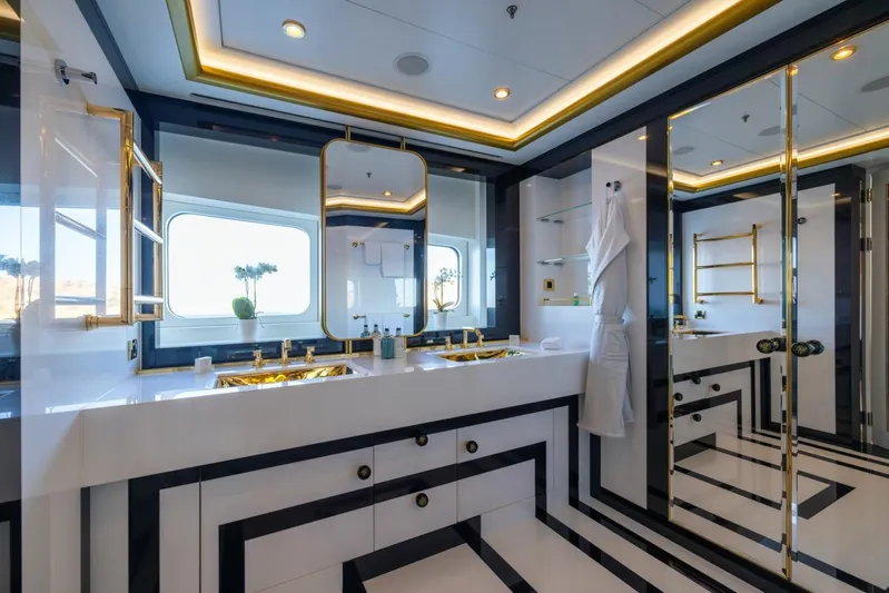 Alfa G Yacht Photos Pics Luxurious yacht bathroom with gold accents, large mirrors, and modern design. Oceanco 60 Meters, 2004.