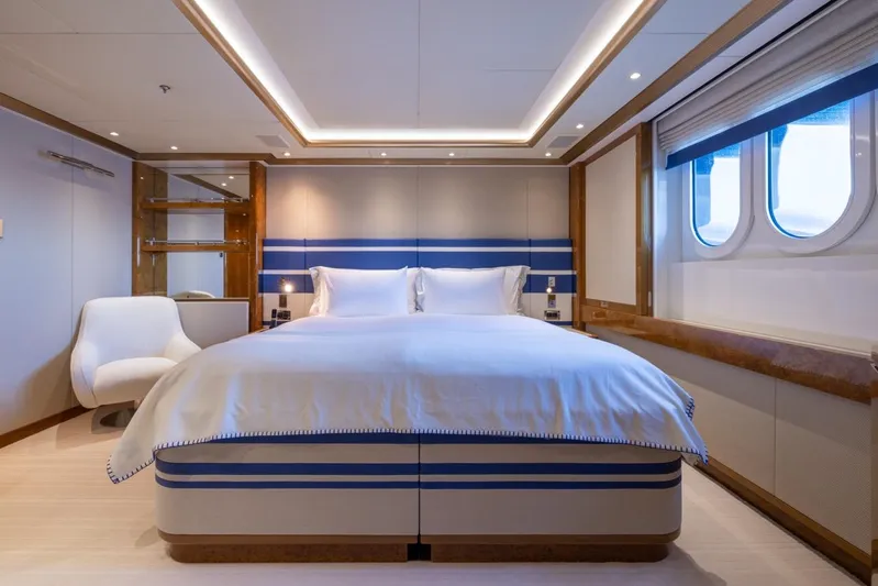 Alfa G Yacht Photos Pics Luxurious bedroom interior on a 2004 Oceanco 60-meter yacht, featuring elegant design and ocean views.
