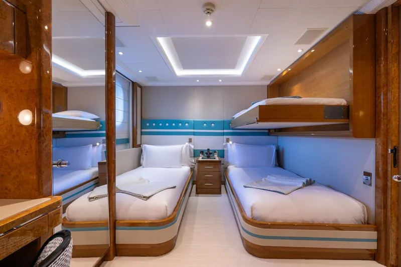 Alfa G Yacht Photos Pics Luxurious twin cabin interior on a 2004 Oceanco 60-meter yacht, featuring modern design and cozy beds.